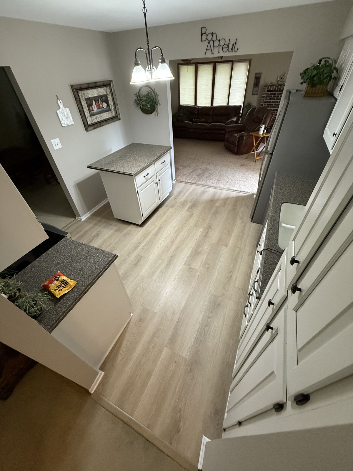 Kitchen remodel with LVP flooring and white cabinets